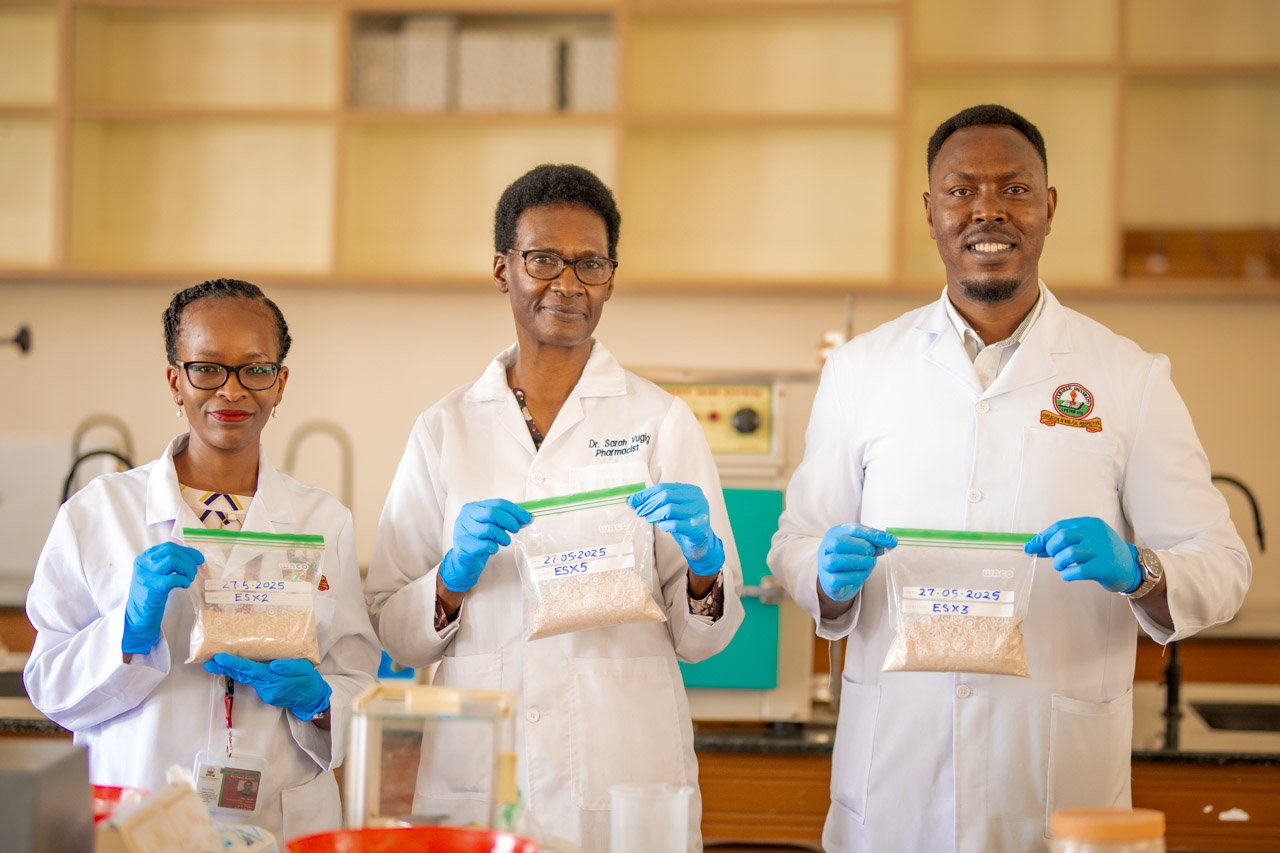 Dr. Sarah Vugigi with Kabarak University colleagues in a pharmaceutical laboratory